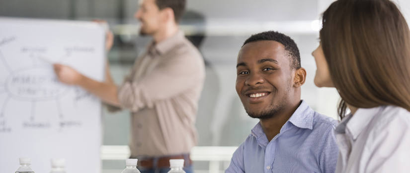 male student studying in a classroom