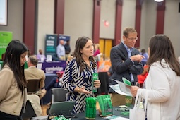Vendor helping staff at expo