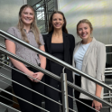 Interns posing on staircase