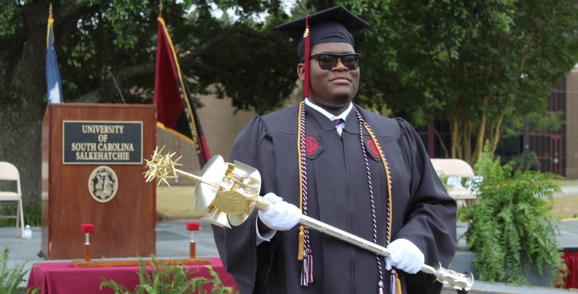J-Dan Shaw carried the mace at commencement