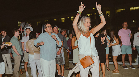 Parents dancing at the Rock the Roost event.