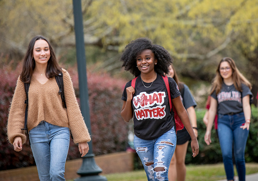 Studnets walking around outside campus. 