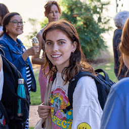 student smiling at an event