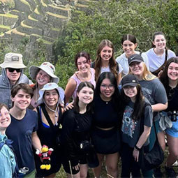 history students smiling on a mountain 