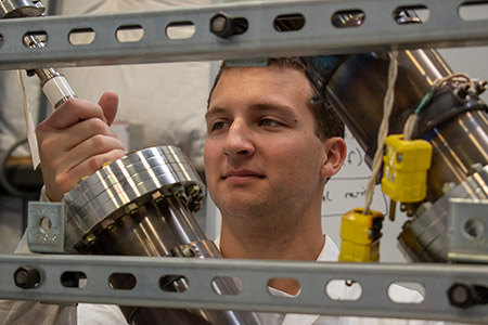 man holding engineering equipment