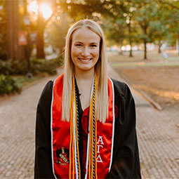 Sophie Large in graduation garb headshot