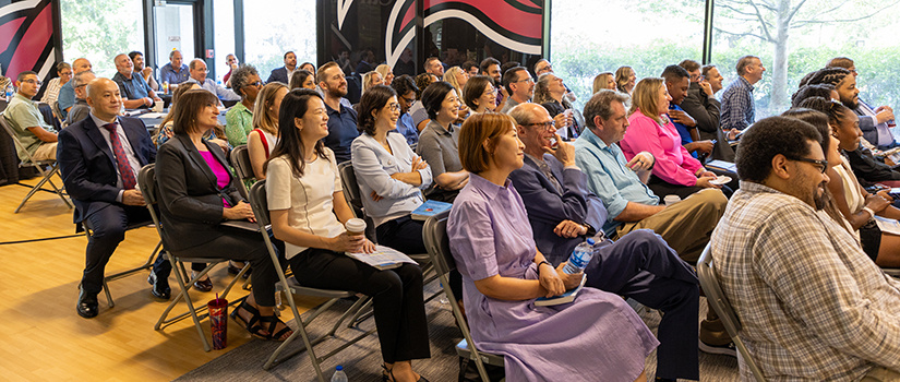 Faculty and staff from HRSM gather for a meeting