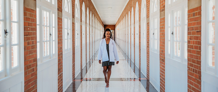 Student Walking Down Long Hallway