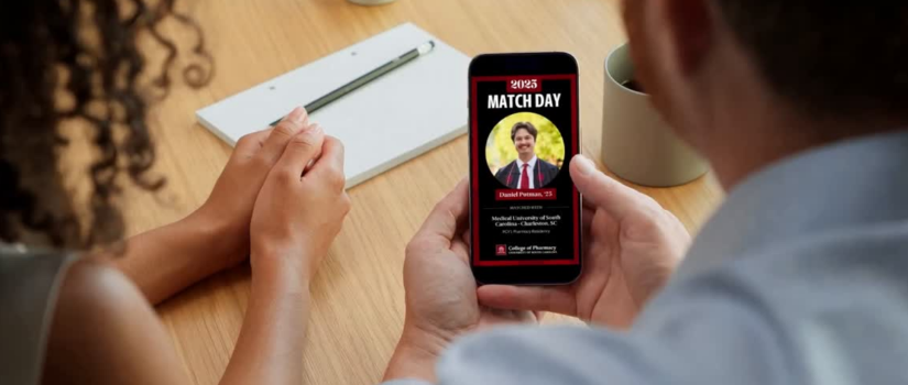 Hands holding phone with Match Day graphic
