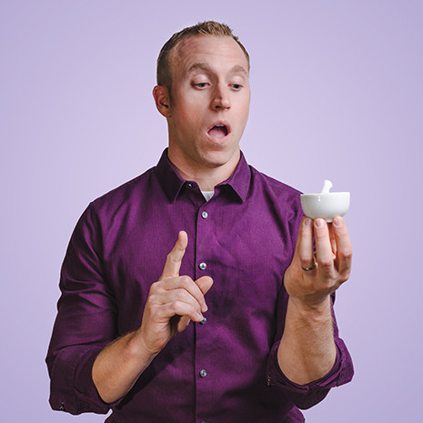 Man holding a mortar and pestle