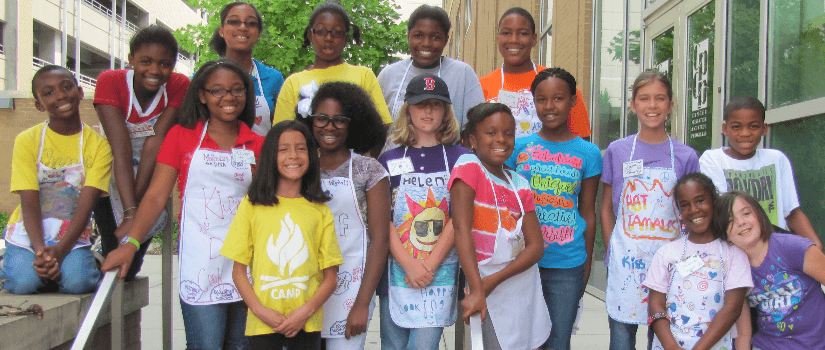 Group of children wearing aprons