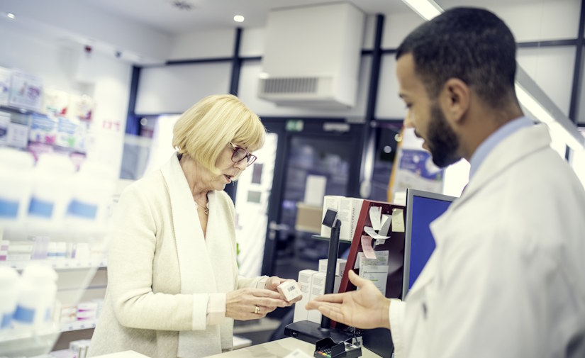 older woman at pharmacy