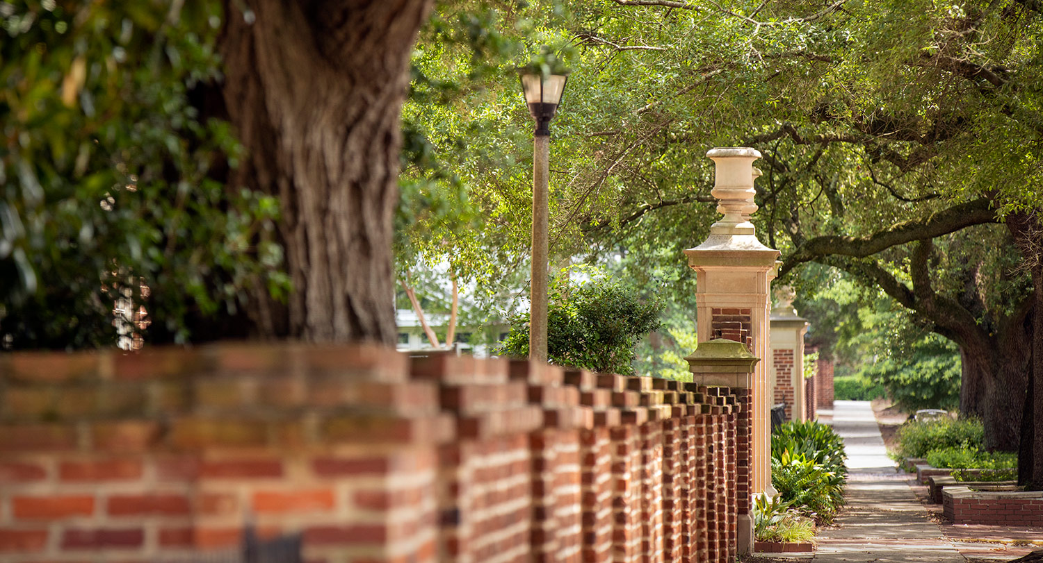 The brick wall and iconic pillars surrounding the Horseshoe. 