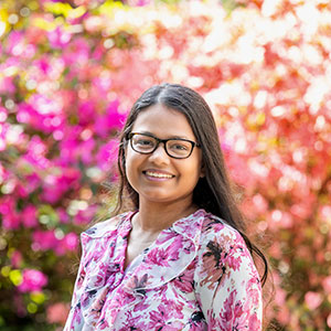 Vrutti Patel standing outside.