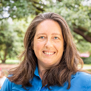 Head shot of woman looking at camera