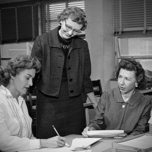 Ada B. Thomas with two other women at a table.